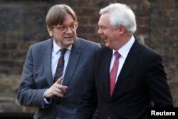 Guy Verhofstadt, the European Union's chief Brexit negotiator, and Britain's Secretary of State for Exiting the European Union David Davis walk up Downing Street in London, March 6, 2018.