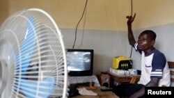 Jean-Noel Kouame speaks with Reuters inside his house on the outer limits of Abidjan, Ivory Coast, Dec. 18, 2017. 