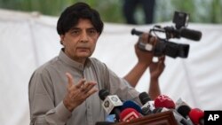 FILE - Pakistani Interior Minister Chaudhry Nisar Ali Khan speaks to reporters in Islamabad, Sept. 23, 2016. He said Friday that as a "goodwill gesture" Pakistan would removed Cyril Almeida's name from a travel ban.
