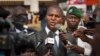 FILE - Faustin-Archange Touadera (C) is seen speaking to the media in downtown Bangui, Central African Republic, Jan. 5, 2013.