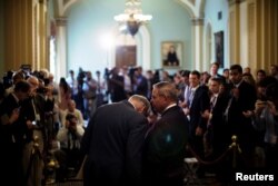 U.S. Sen. Bob Menendez (D-NJ) talks to Senate Minority Leader Chuck Schumer (D-NY) before speaking to reporters at the Capitol as fallout continued over U.S. President Donald Trump's Helsinki summit with Russian President Vladimir Putin, in Washington, U.S., July 17, 2018.