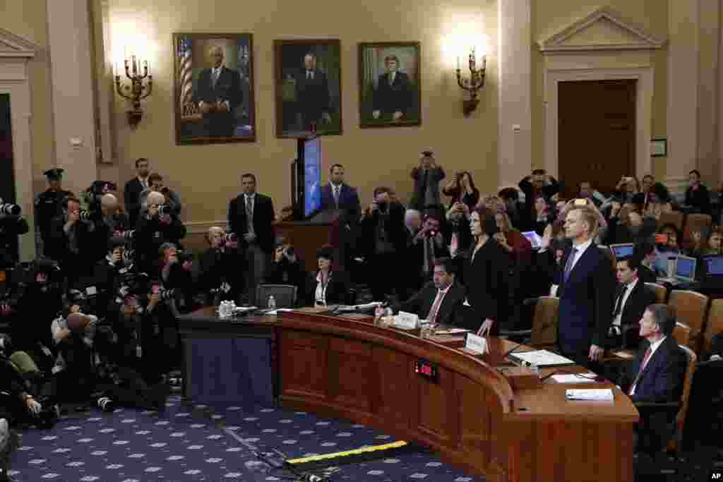 Former White House National Security aide Fiona Hill, and David Holmes, a U.S. diplomat in Ukraine, are sworn in to testify before the House Intelligence Committee on Capitol Hill in Washington during a public impeachment hearing of President Donald Trump.