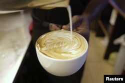 FILE — A cappuccino is prepared at a Nairobi Java House outlet in Nairobi.