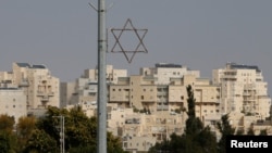 A general view shows a Star of David near buildings in the Israeli settlement of Maale Edumim, in the occupied West Bank, Dec. 28, 2016.