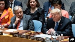 President Donald Trump addresses the United Nations Security Council during the 73rd session of the United Nations General Assembly, at U.N. headquarters in New York, Sept. 26, 2018. At left is United Nations Secretary-General Antonio Guterres.