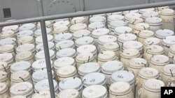 Barrels containing confiscated cocaine are displayed on a French military vessel in the port of Monrovia, Liberia. (file photo)