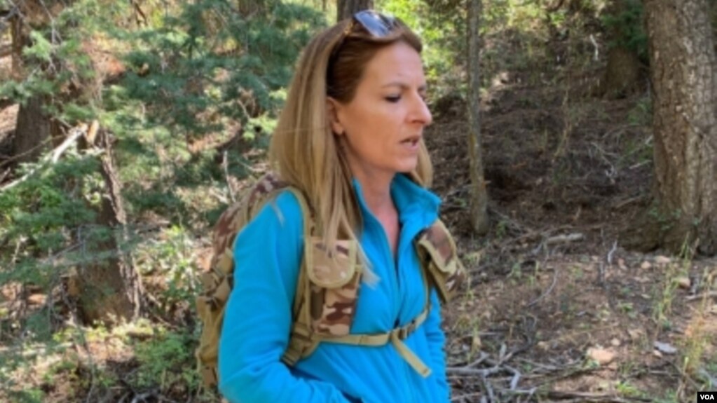 Sacha Johnston, a single mother and real estate agent, is scouring the landscape of the Black Canyon Campground north of Santa Fe, New Mexico, in search of a hidden treasure. (VOA/Penelope Poulou)