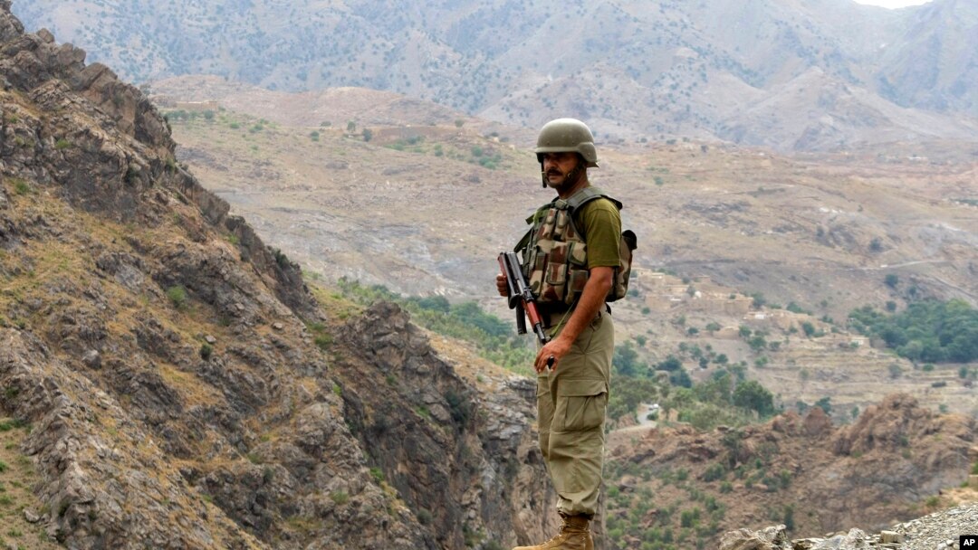 FILE - A Pakistan army soldier stands guard in the Pakistani tribal area of Khyber near the Torkham border post between Pakistan and Afghanistan, June 15, 2016.