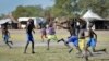 FILE - In this photo taken Dec. 8, 2017, boys play a game of soccer in Jiech, Ayod County, South Sudan.