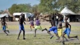 FILE - In this photo taken Dec. 8, 2017, boys play a game of soccer in Jiech, Ayod County, South Sudan.