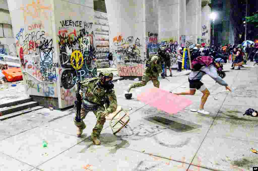 Federal officers disperse Black Lives Matter demonstrators at the Mark O. Hatfield United States Courthouse, July 22, 2020, in Portland, Oregon.