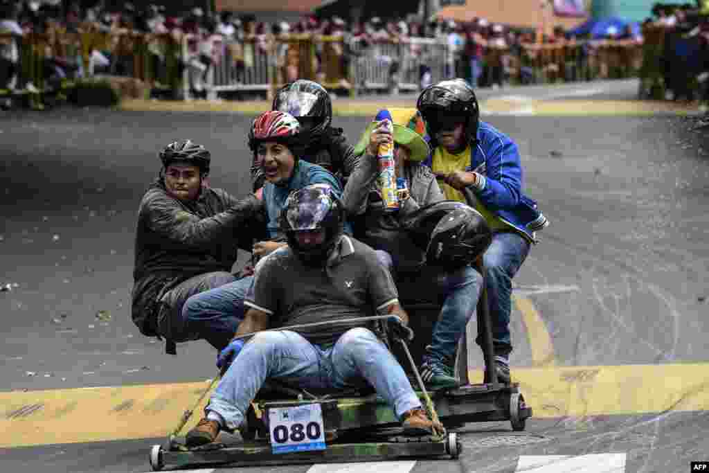 Participants ride down a hill in a home-made vehicle during the 29th Car Festival in Medellin,&nbsp; Colombia on November 18, 2018.