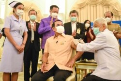 This handout from the Royal Thai Government taken and released on March 16, 2021, shows Thailand's Prime Minister Prayuth Chan-ocha receiving the Oxford/AstraZeneca Covid-19 coronavirus vaccine in Bangkok.