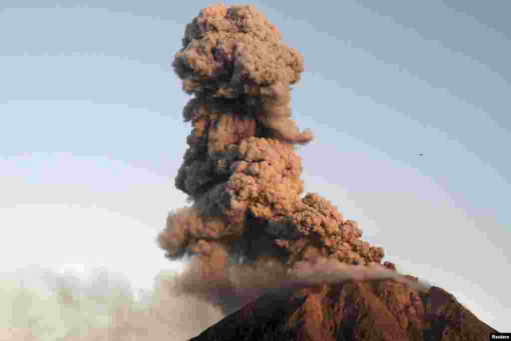 Mount Sinabung volcano spews lava and ash during an eruption as seen from Tiga Serangkai village in Karo, Indonesia&#39;s North Sumatra province, in this photo taken by Antara Foto.