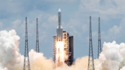 FILE - The Long March 5 Y-4 rocket, carrying an unmanned Mars probe of the Tianwen-1 mission, takes off from Wenchang Space Launch Center in Wenchang, Hainan Province, China, July 23, 2020.