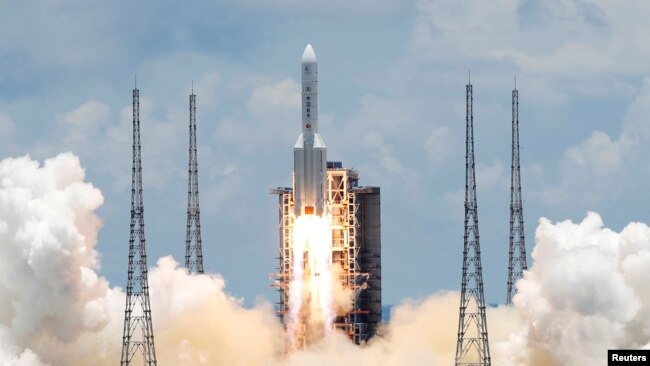 FILE - The Long March 5 Y-4 rocket, carrying an unmanned Mars probe of the Tianwen-1 mission, takes off from Wenchang Space Launch Center in Wenchang, Hainan Province, China, July 23, 2020.