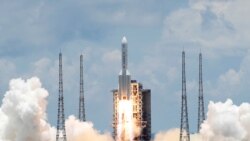 FILE - The Long March 5 Y-4 rocket, carrying an unmanned Mars probe of the Tianwen-1 mission, takes off from Wenchang Space Launch Center in Wenchang, Hainan Province, China, July 23, 2020.