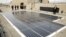 FILE - Solar panels are seen on the roof of the Department of Energy in Washington, March 19, 2015. 