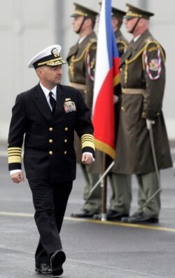 NATO Supreme Allied Commander U.S. Admiral James Stavridis walks past an honor guard during a welcoming ceremony in Prague, March 29, 2010.