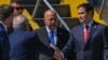 US Secretary of State Marco Rubio (R) is welcomed by Guatemalan Foreign Minister Carlos Ramiro Martinez (C) at La Aurora International Airport in Guatemala City on February 4, 2025. (Photo by Johan ORDONEZ / AFP)