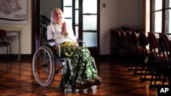 FILE - In this photo released by LongeviQuest, Sister Inah Canabarro, then 115, puts her hands together in prayer, in Porto Alegre, Brazil, Feb. 16, 2024. (Carlos Macedo/LongeviQuest, via AP)