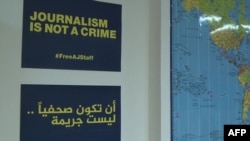 "Le journaliste n'est pas un crime", indique le panneau dans un bureau à Paris, le 9 octobre 2018.