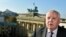 Former Soviet Leader Mikhail Gorbachev stands in front of the Brandenburg Gate in Berlin, Germany, Nov. 8, 2014. 