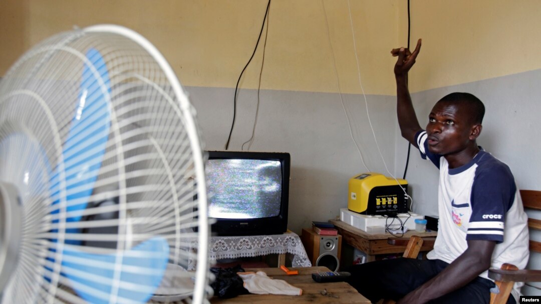 Jean-Noel Kouame speaks with Reuters inside his house on the outer limits of Abidjan, Ivory Coast, Dec. 18, 2017. 
