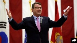 U.S. Defense Secretary Ash Carter addresses U.S. military personnel during a meeting at Osan Air Base in Pyeongtaek, south of Seoul, South Korea, April 9, 2015. 