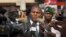 FILE - Faustin-Archange Touadera (C) is seen speaking to the media in downtown Bangui, Central African Republic, Jan. 5, 2013.