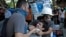 A protester affected by tear gas is helped by other protesters to a field hospital in Gezi Park in Taksim square in Istanbul, June 11, 2013. 