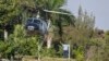 Un helicóptero aterriza para evacuar al personal de la embajada de República Dominicana en Puerto Príncipe, Haití, el jueves 21 de marzo de 2024.
