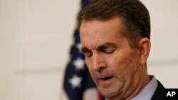 Virginia Gov. Ralph Northam pauses during a news conference in the Governor's Mansion in Richmond, Feb. 2, 2019. Northam is under fire for a racially insensitive photo that appeared in his college yearbook.