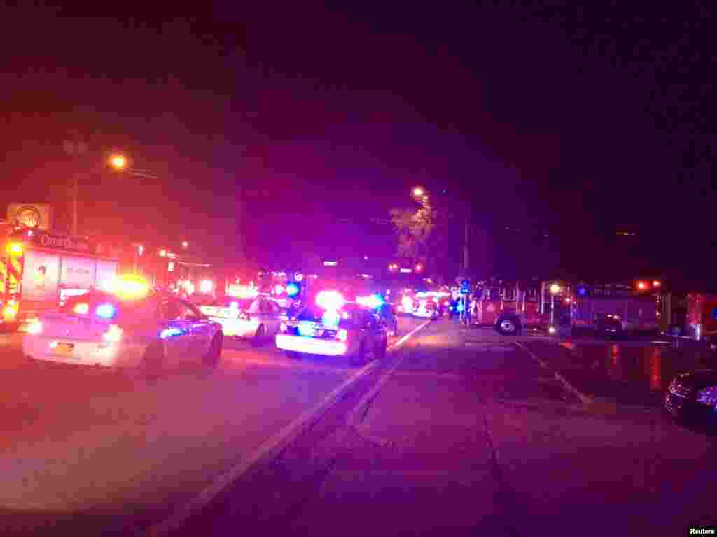 Police cars and fire trucks are seen outside the Pulse night club after a mass shooting, Orlando, Florida, June 12, 2016.