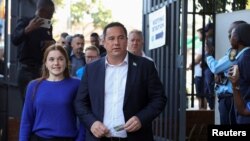 FILE - John Steenhuisen, leader of the South African opposition party Democratic Alliance (DA) walks next to his daughter Caroline during the South African elections in Durban, South Africa May 29, 2024. .