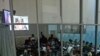 People watch a live broadcast of the verdict in the Netherlands-based trial of former Liberian president Charles Taylor, at the Special Court for Sierra Leone, in Freetown, Sierra Leone, April 26, 2012.