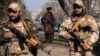 FILE - Taliban fighters stand guard in Kabul, Dec. 26, 2022. 