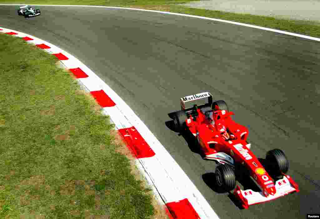 Michael Schumacher leads Williams BMW Colombian driver Juan Pablo Montoya during the Italian Formula One Grand Prix at the Monza race track Sept. 14, 2003. 