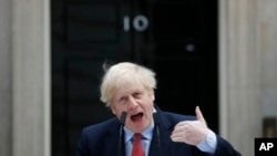 British Prime Minister Boris Johnson makes a statement on his first day back at work in Downing Street, London, after recovering from a bout with the coronavirus that put him in intensive care, April 27, 2020. 