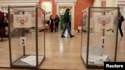 FILE - People vote during leadership elections in rebel-controlled Donetsk, Ukraine, Nov. 11, 2018. 