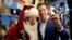 Tom Farley, president of the NYSE Group, poses for a selfie with Santa Claus, who rang the opening bell to celebrate the Macy's 90th Annual Thanksgiving Day Parade, at the New York Stock Exchange in New York City, Nov. 23, 2016. 