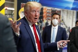 FILE - In this May 21, 2020 file photo, President Donald Trump speaks during a tour of Ford's Rawsonville Components Plant in Ypsilanti, Mich.