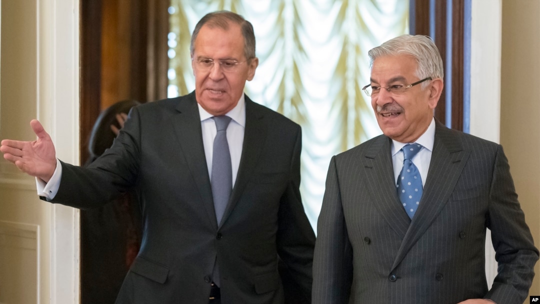 Russian Foreign Minister Lavrov, left, welcomes Pakistan's Foreign Minister Khawaja Muhammad Asif for their talks in Moscow, Russia, Feb. 20, 2018. 