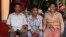 Chheum Sokhoch, middle, is pictured with his father Plung Bunkhiem, 40, and his mother, Voeun Ya, 36, at their home in Krobey Riel commune, Siem Reap, Cambodia, July 13, 2017. (Sun Narin/VOA Khmer)