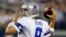 El mariscal de campo de los Vaqueros de Dallas, Tony Romo, se prepara a lanzar la pelota en el juego en el que derrotaron a los Gigantes de Nueva York, 36 por 31.