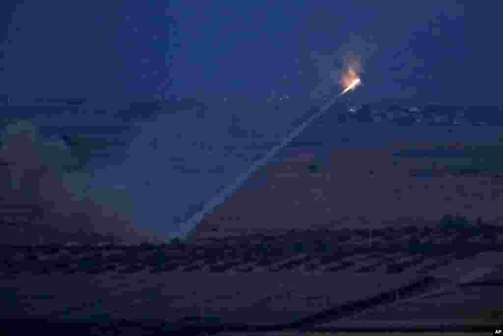 Turkish forces fire rockets toward targets in Ras al-Ayn, Syria, in this photo taken from Ceylanpinar, Sanliurfa province, Turkey.