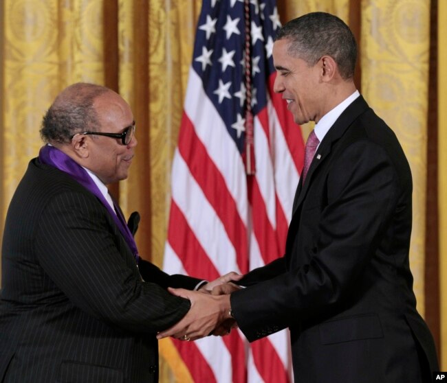 FILE - President Barack Obama presents a 2010 National Medal of Arts to musician and record producer Quincy Jones, Wednesday, March 2, 2011, during a ceremony in the East Room of the White House in Washington. (AP Photo/Pablo Martinez Monsivais, File)