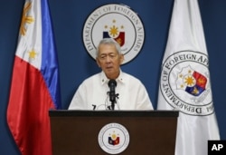 FILE - Philippine Foreign Affairs Secretary Perfecto Yasay Jr. issues a statement on the recent ruling in a long-running dispute between the Philippines and China over the South China Sea during a press conference in suburban Pasay, south of Manila, Phili