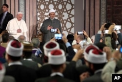Pope Francis is flanked by Sheikh Dr. Ahmad Al-Tayyeb, Al-Azhar's grand imam, at Al-Azhar University, in Cairo, Egypt, April 28, 2017.