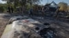 Ukrainian servicemen examine fragments of a Russian military plane that was shot down on the outskirts of Kostyantynivka, a near-front line city in the Donetsk region, Ukraine, Oct. 5, 2024.